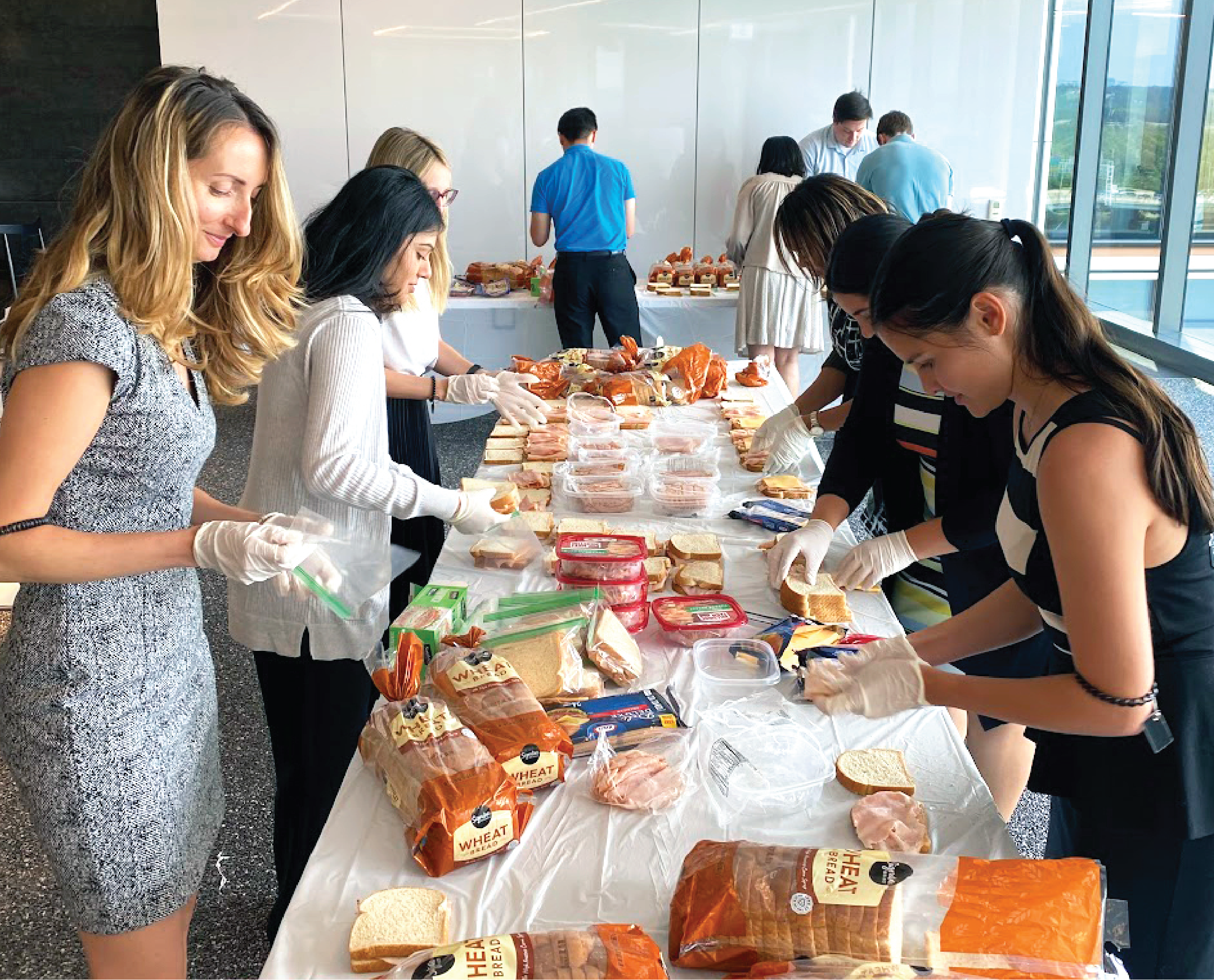 Fish members making sandwiches for a pro bono event